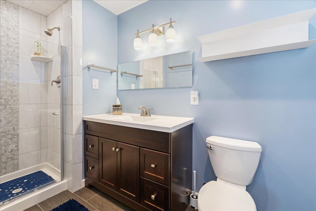 7261 Dry Creek Road Rio Linda, CA 95673 - Photo 22 of 60 a bathroom with a toilet sink and mirror