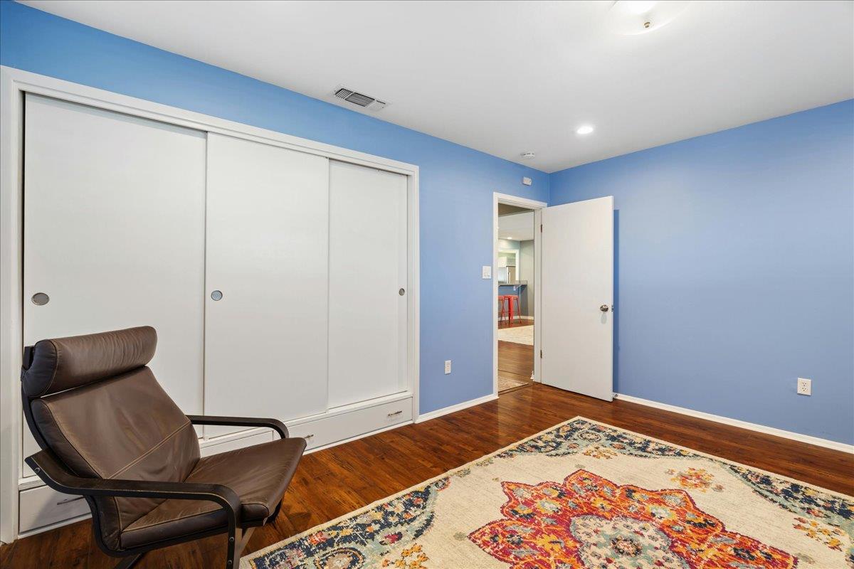 7261 Dry Creek Road Rio Linda, CA 95673 - Photo 22 of 59 a bedroom with a bed and a chair
