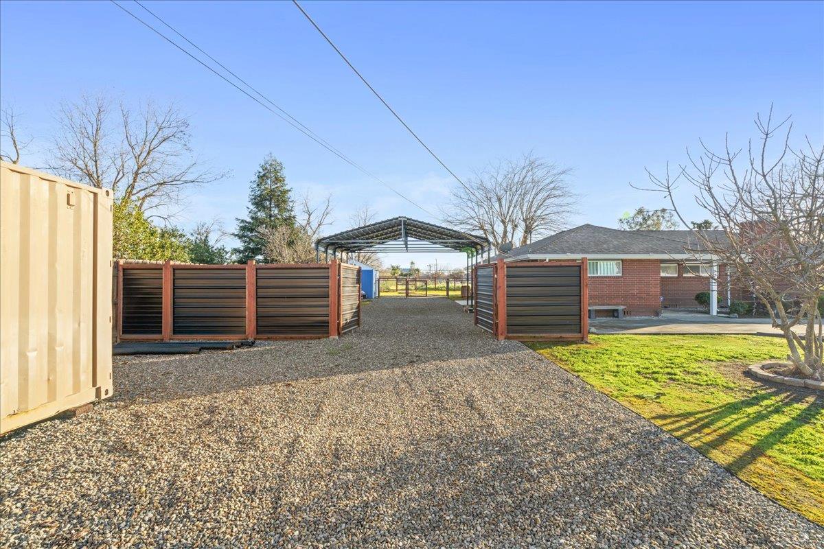 7261 Dry Creek Road Rio Linda, CA 95673 - Photo 24 of 60 a view of a house with a yard and garage