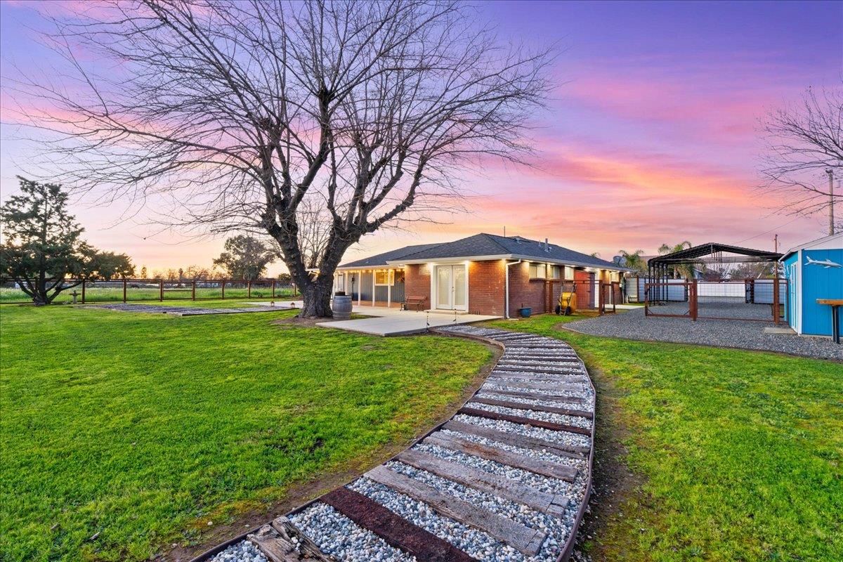 7261 Dry Creek Road Rio Linda, CA 95673 - Photo 29 of 60 a front view of a house with a yard