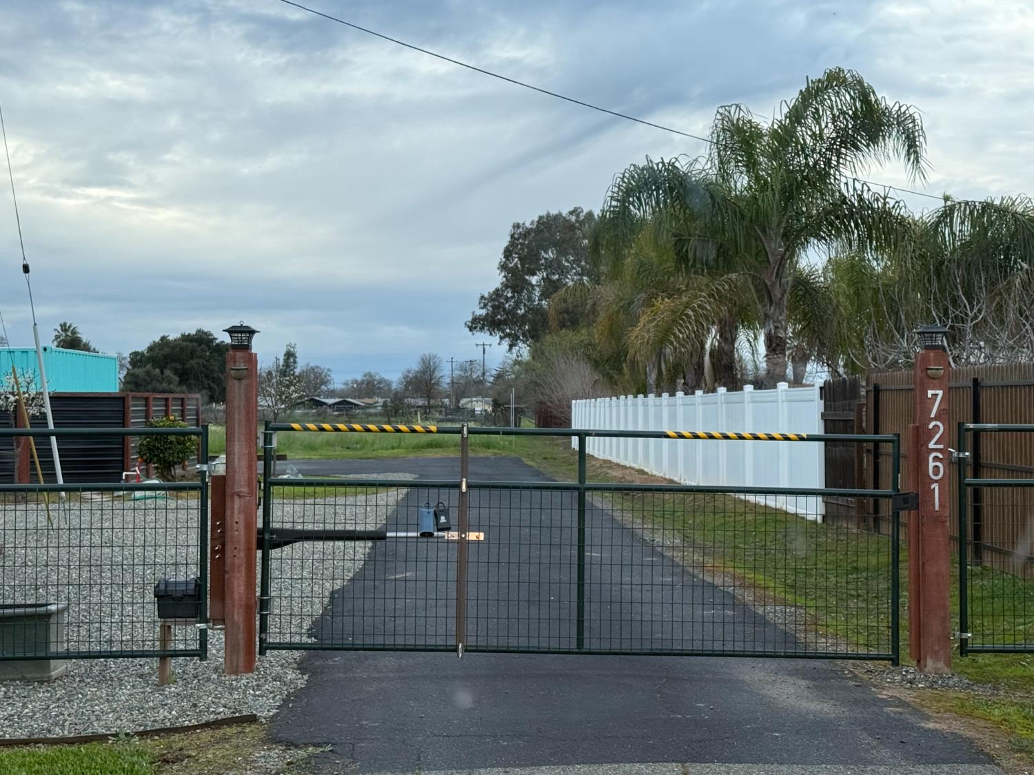 7261 Dry Creek Road Rio Linda, CA 95673 - Photo 3 of 59 a view of a pathway with a wrought fence