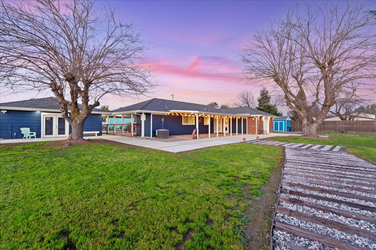 7261 Dry Creek Road Rio Linda, CA 95673 - Photo 31 of 60 a front view of a house with garden and trees