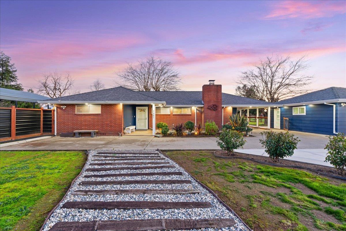 7261 Dry Creek Road Rio Linda, CA 95673 - Photo 42 of 59 a front view of a house with a yard