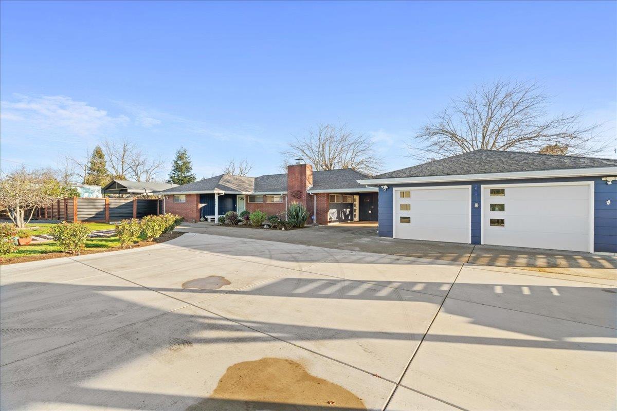 7261 Dry Creek Road Rio Linda, CA 95673 - Photo 59 of 59 a front view of a house with a garden and garage