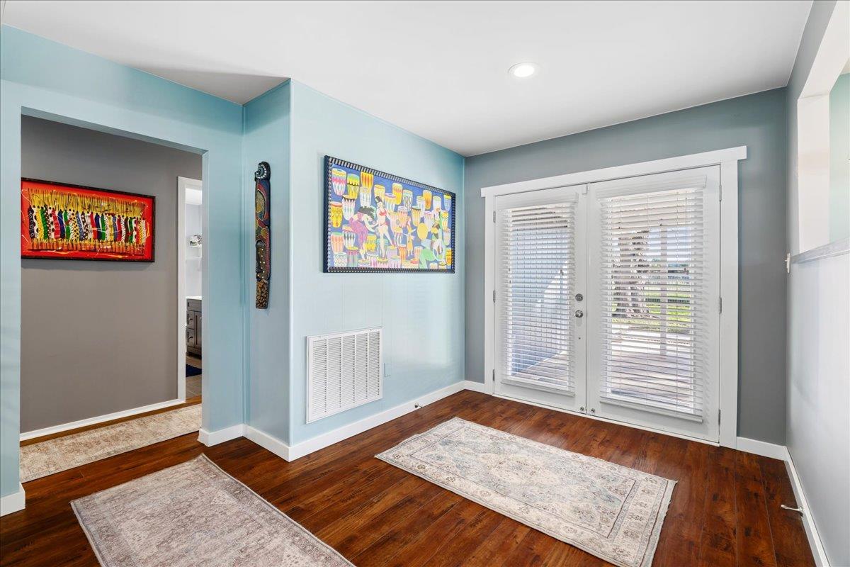 7261 Dry Creek Road Rio Linda, CA 95673 - Photo 7 of 60 a view of an empty room with window and wooden floor