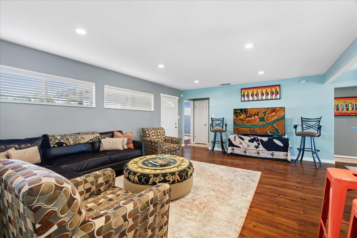 7261 Dry Creek Road Rio Linda, CA 95673 - Photo 10 of 60 a living room with furniture and a flat screen tv