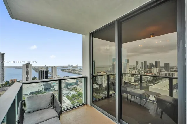 a view of a balcony with furniture