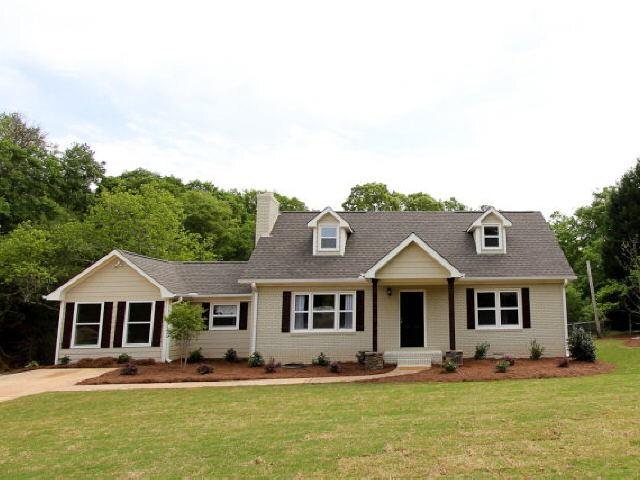 390 Rays Church Road Bishop, GA 30621 - Photo 1 of 1 a front view of a house with a yard