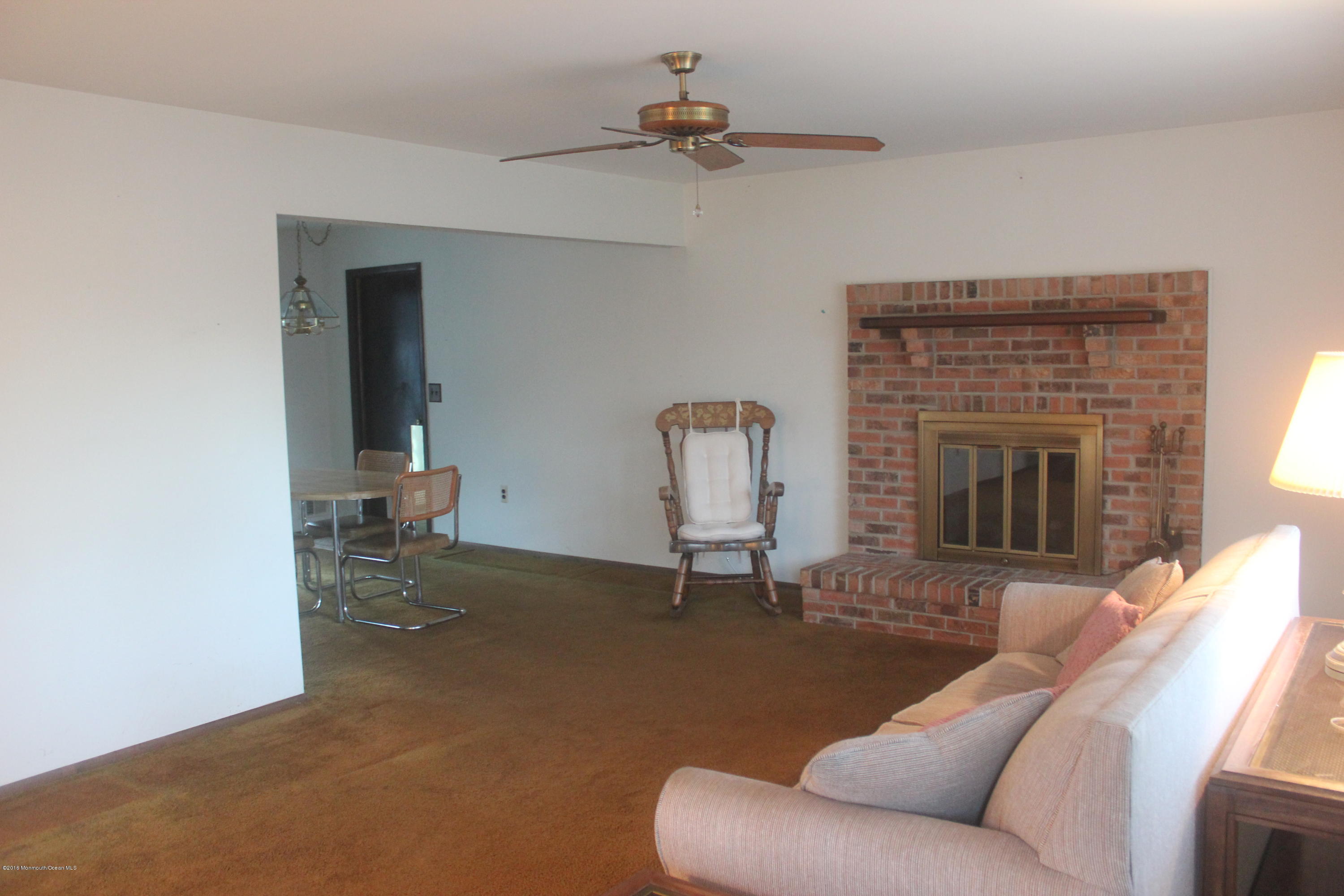 174 Club House Road Brick, NJ 08723 - Photo 2 of 40 Living room with wood burning fireplace