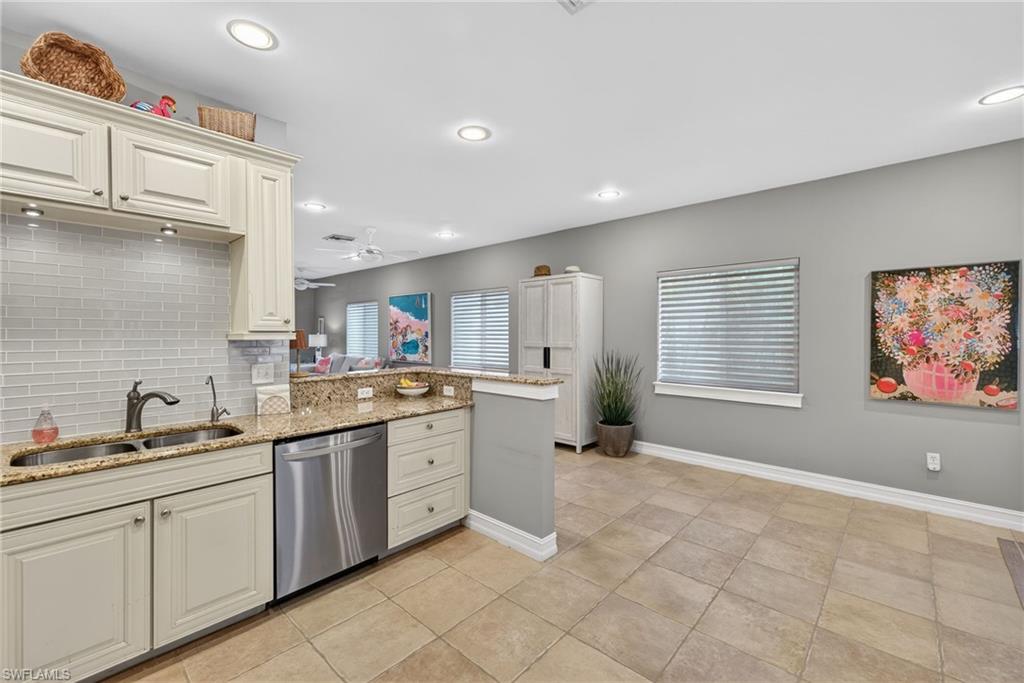 740 5th Avenue North Naples, FL 34102 - Photo 11 of 43 a kitchen with a sink cabinets and window