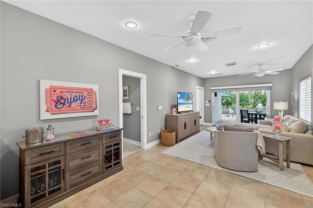 740 5th Avenue North Naples, FL 34102 - Photo 15 of 43 a living room with furniture and a window