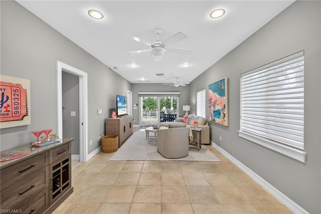 740 5th Avenue North Naples, FL 34102 - Photo 17 of 43 a very nice looking dining room with a large window