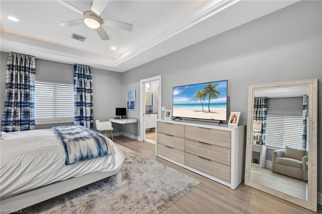 740 5th Avenue North Naples, FL 34102 - Photo 23 of 43 a living room with furniture and a large window