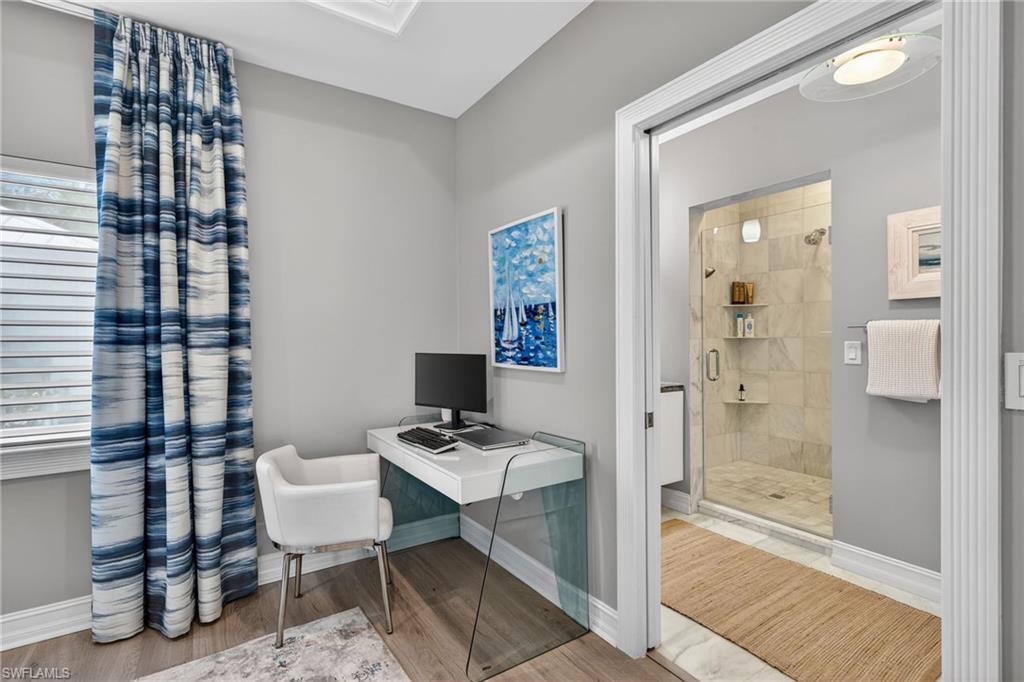 740 5th Avenue North Naples, FL 34102 - Photo 24 of 43 a bathroom with a sink toilet and shower
