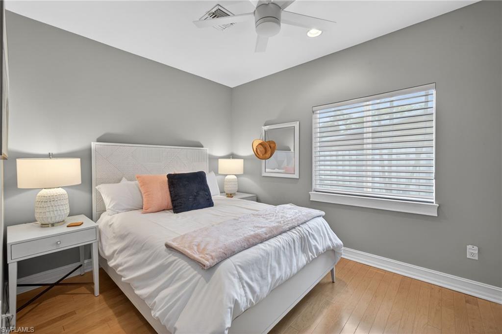 740 5th Avenue North Naples, FL 34102 - Photo 29 of 43 a bedroom with a bed and window