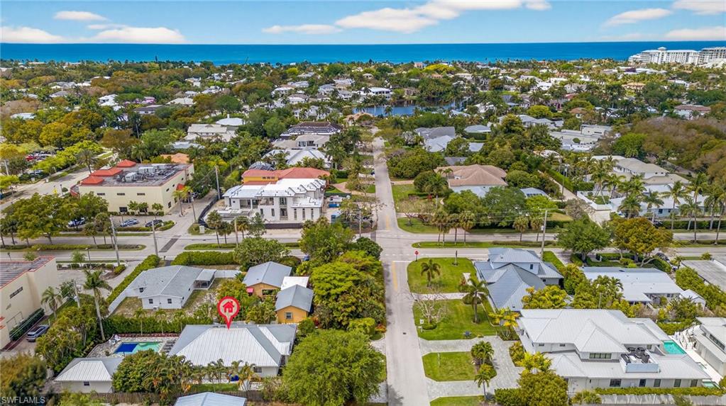 740 5th Avenue North Naples, FL 34102 - Photo 42 of 43 an aerial view of residential houses with outdoor space and swimming pool