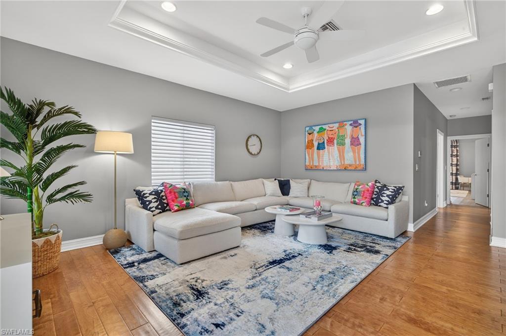 740 5th Avenue North Naples, FL 34102 - Photo 5 of 43 a living room with furniture and a potted plant