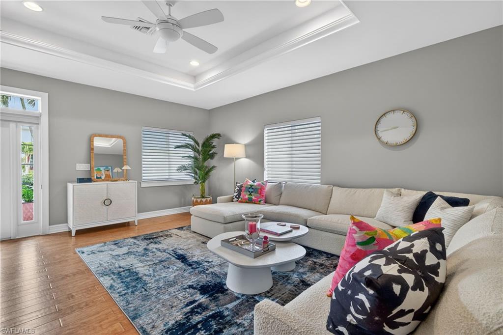 740 5th Avenue North Naples, FL 34102 - Photo 6 of 43 a living room with furniture and wooden floor
