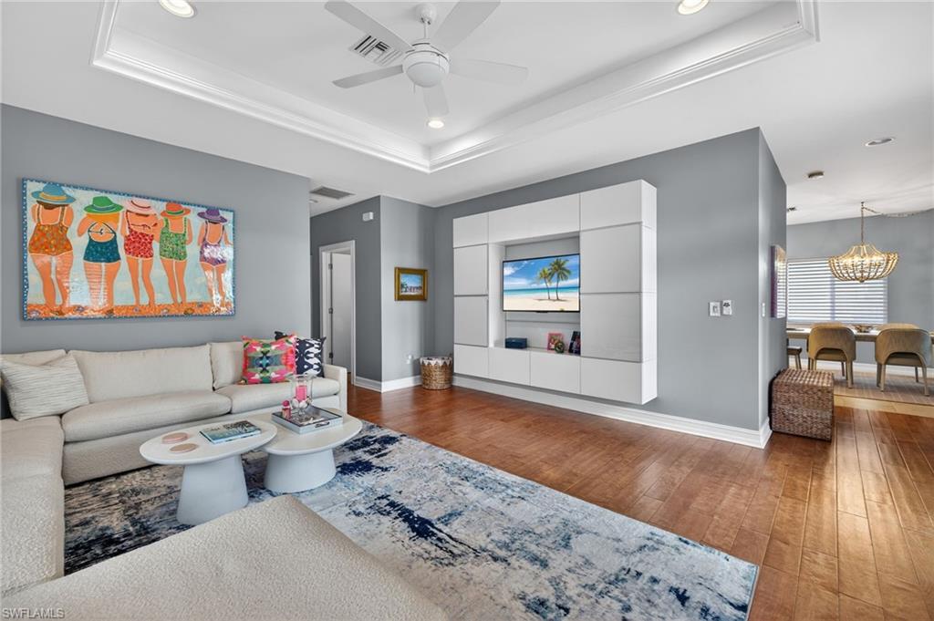740 5th Avenue North Naples, FL 34102 - Photo 7 of 43 a living room with furniture and a wooden floor
