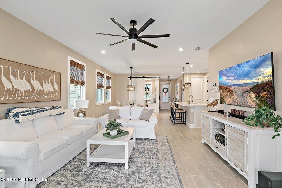 110 Fly Line Drive St. Johns, FL 32259 - Photo 13 of 65 a living room with furniture and a large window