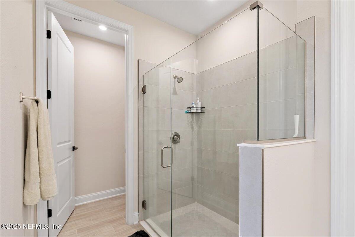 110 Fly Line Drive St. Johns, FL 32259 - Photo 17 of 65 a bathroom with a shower and a glass door