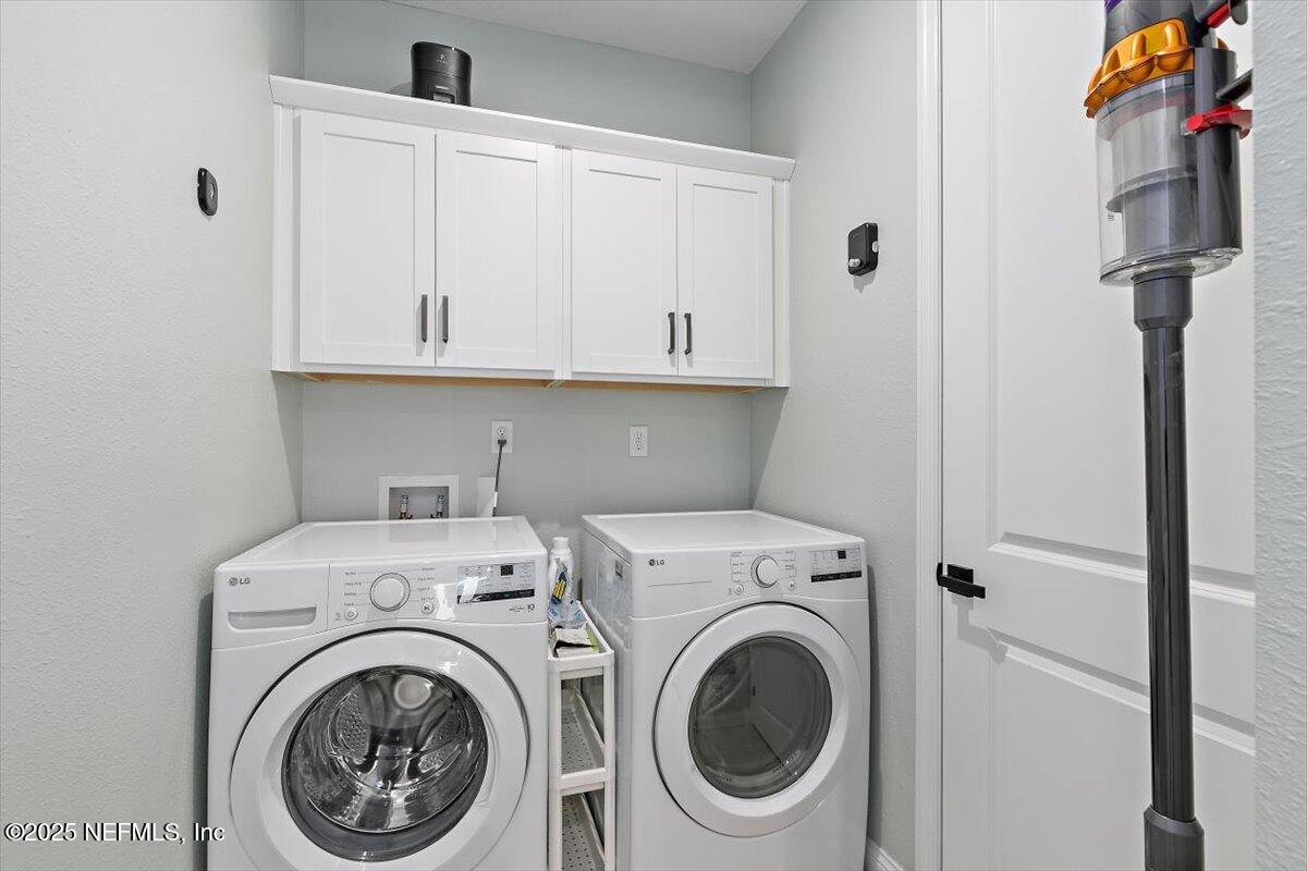 110 Fly Line Drive St. Johns, FL 32259 - Photo 20 of 65 a view of storage and utility room with washer and dryer