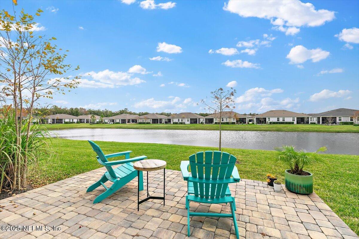 110 Fly Line Drive St. Johns, FL 32259 - Photo 21 of 65 a view of a lake with a patio