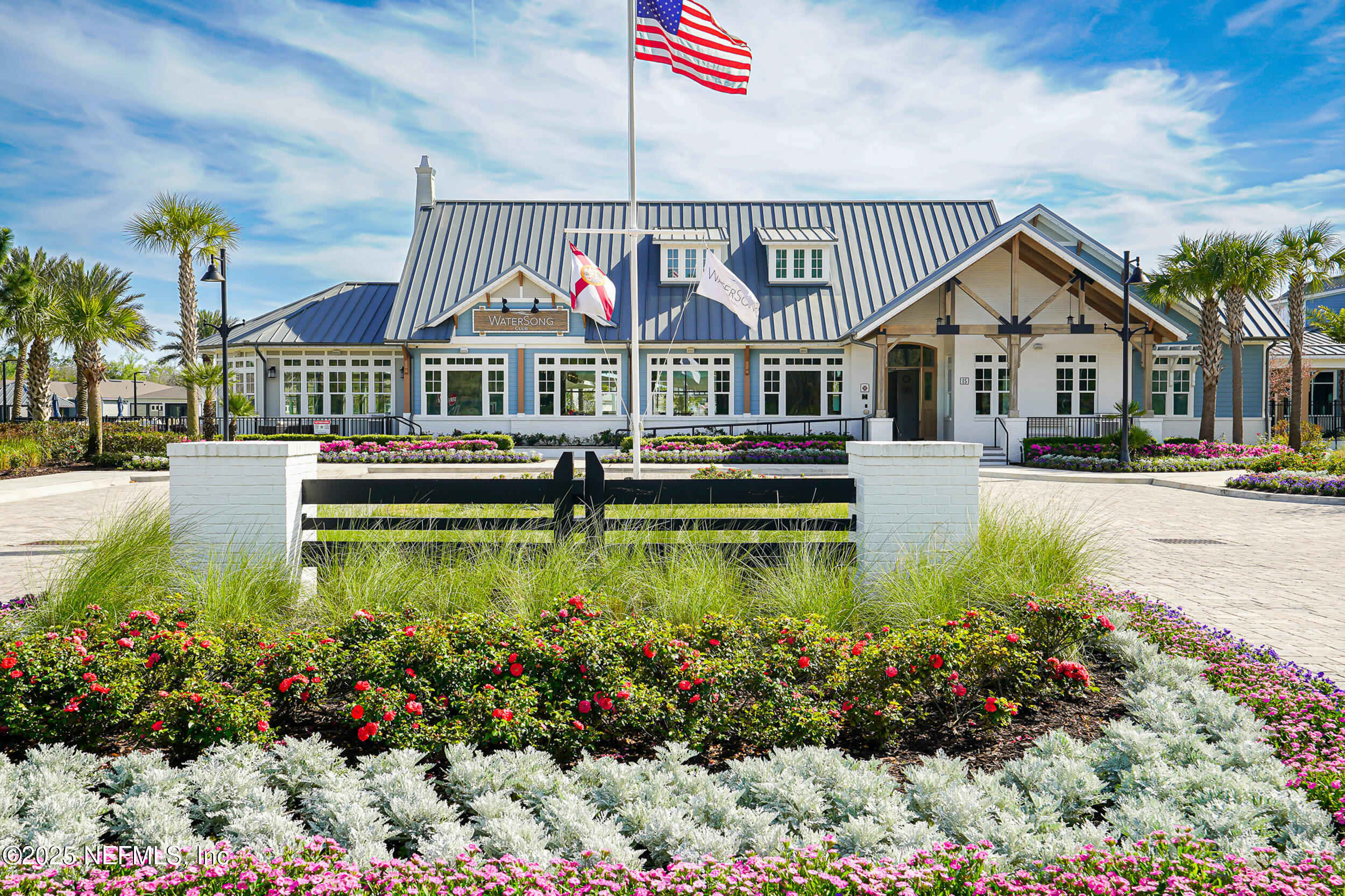 110 Fly Line Drive St. Johns, FL 32259 - Photo 29 of 65 a front view of a house with a yard and potted plants