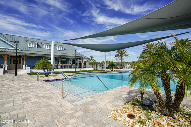 a view of a chairs and table in the garden