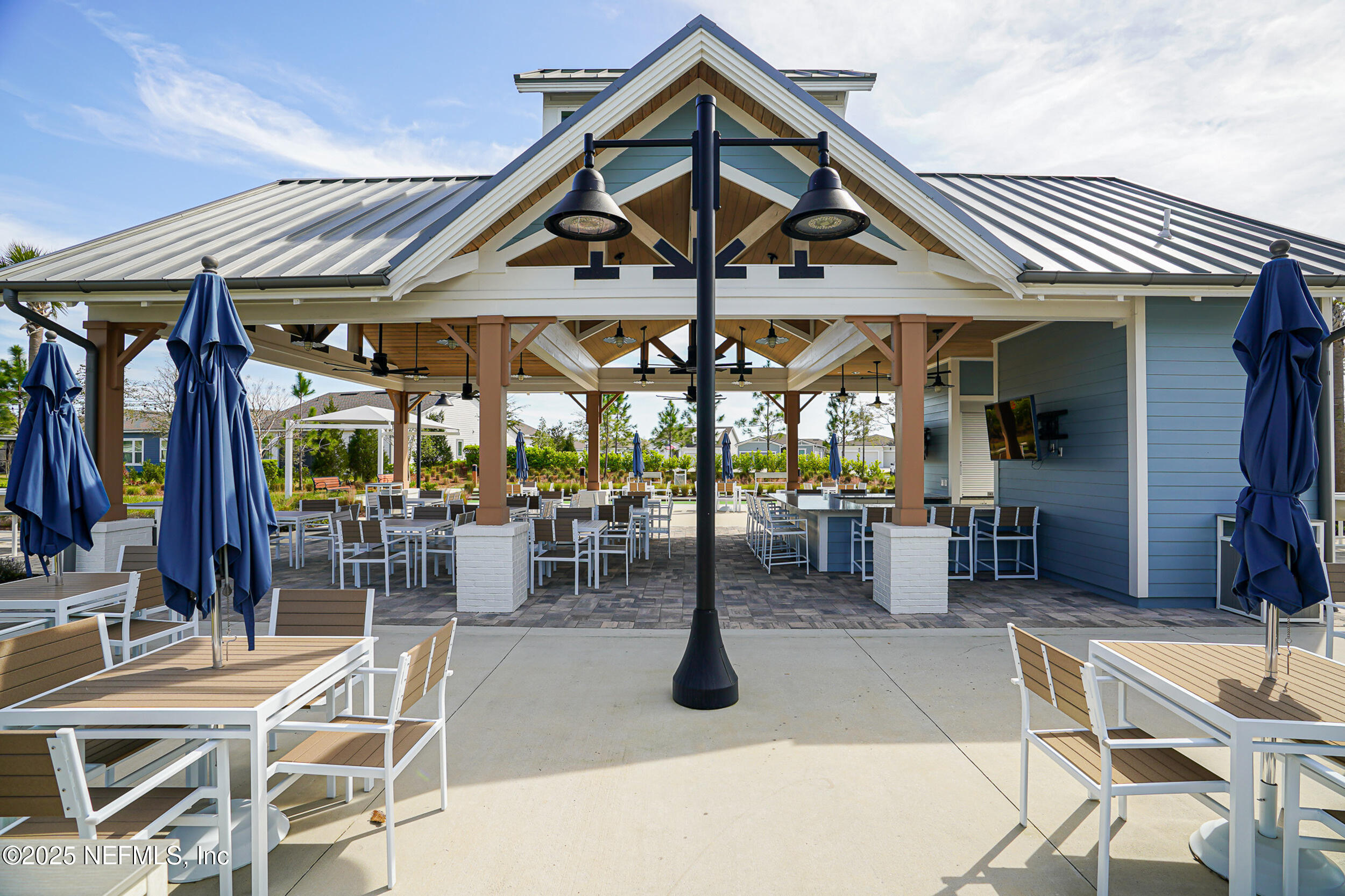 110 Fly Line Drive St. Johns, FL 32259 - Photo 39 of 65 a view of a dinning table and chairs in the patio
