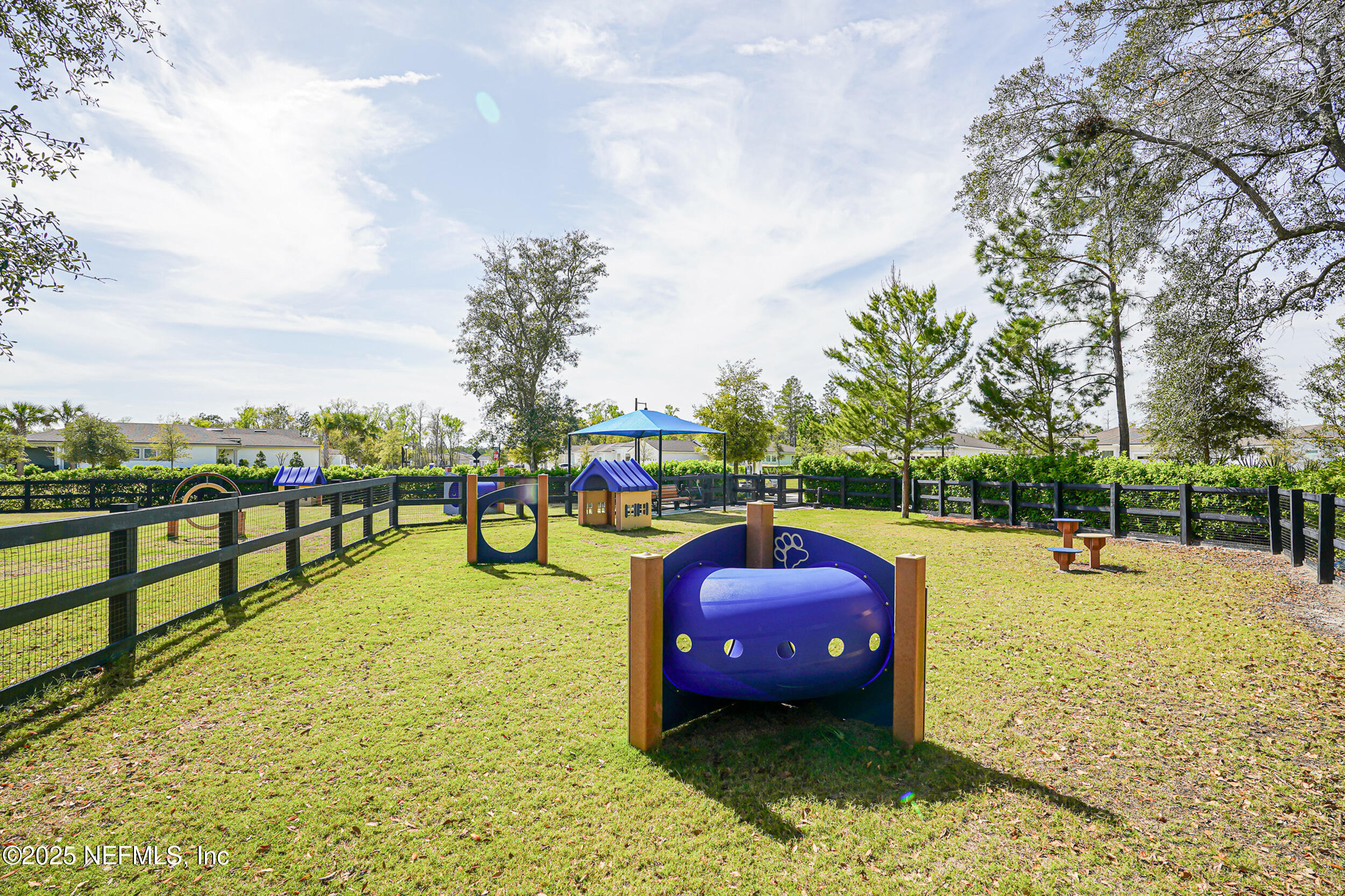 110 Fly Line Drive St. Johns, FL 32259 - Photo 45 of 65 a view of a swimming pool with a garden and seating area