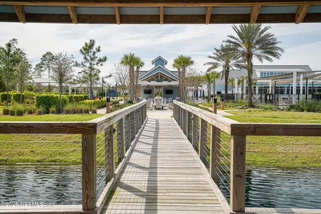 a view of a swimming pool with outdoor seating