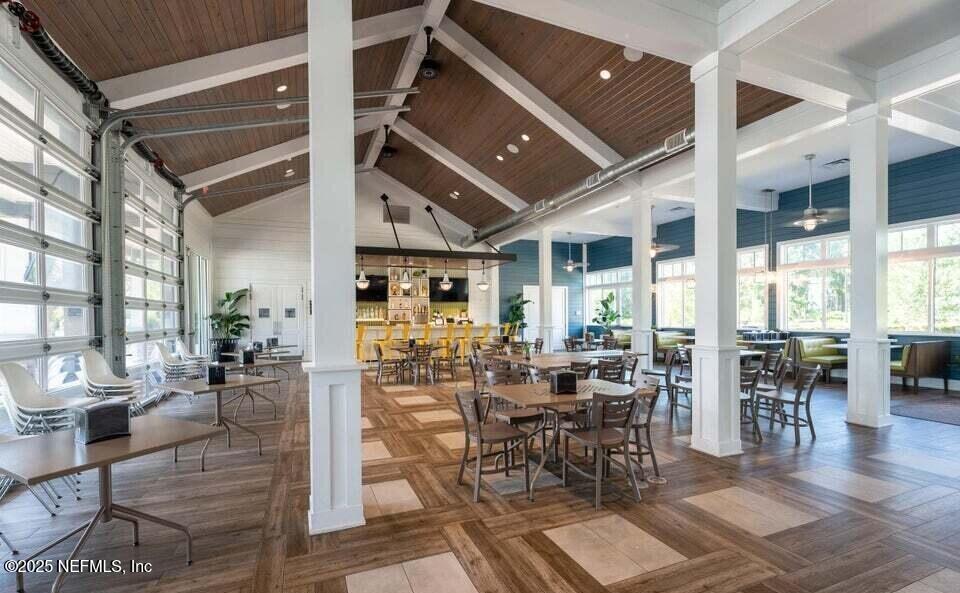 110 Fly Line Drive St. Johns, FL 32259 - Photo 58 of 65 a view of a dining hall with lots of furniture and wooden floor