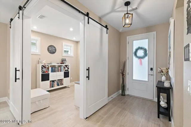 a living room with furniture and window