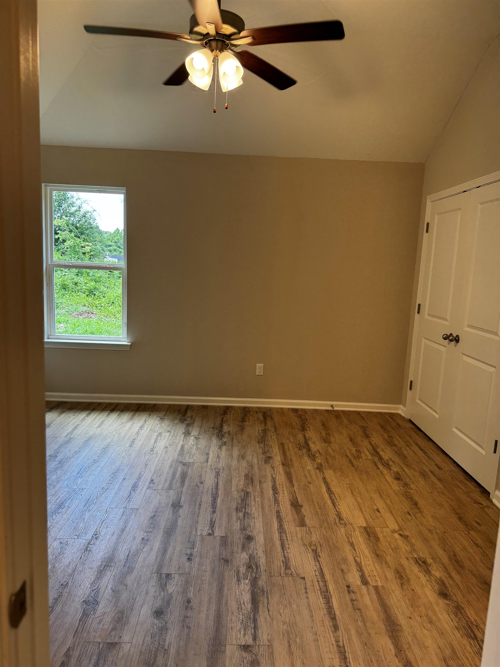 5283 Zodiac Road Memphis, TN 38118 - Photo 6 of 13 Interior room featuring vaulted ceilings and wood-finish flooring