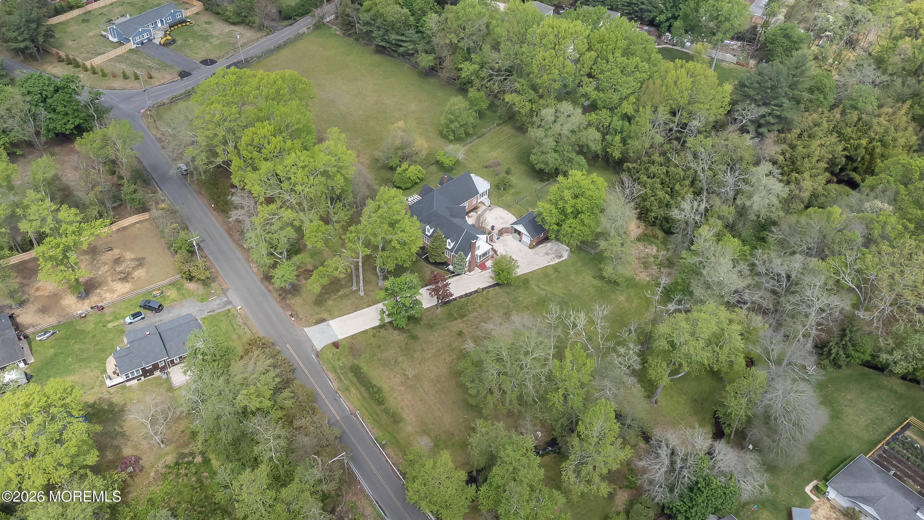 187 Hockhockson Road Colts Neck, NJ 07722 - Photo 55 of 55 an aerial view of residential house with outdoor space and trees all around