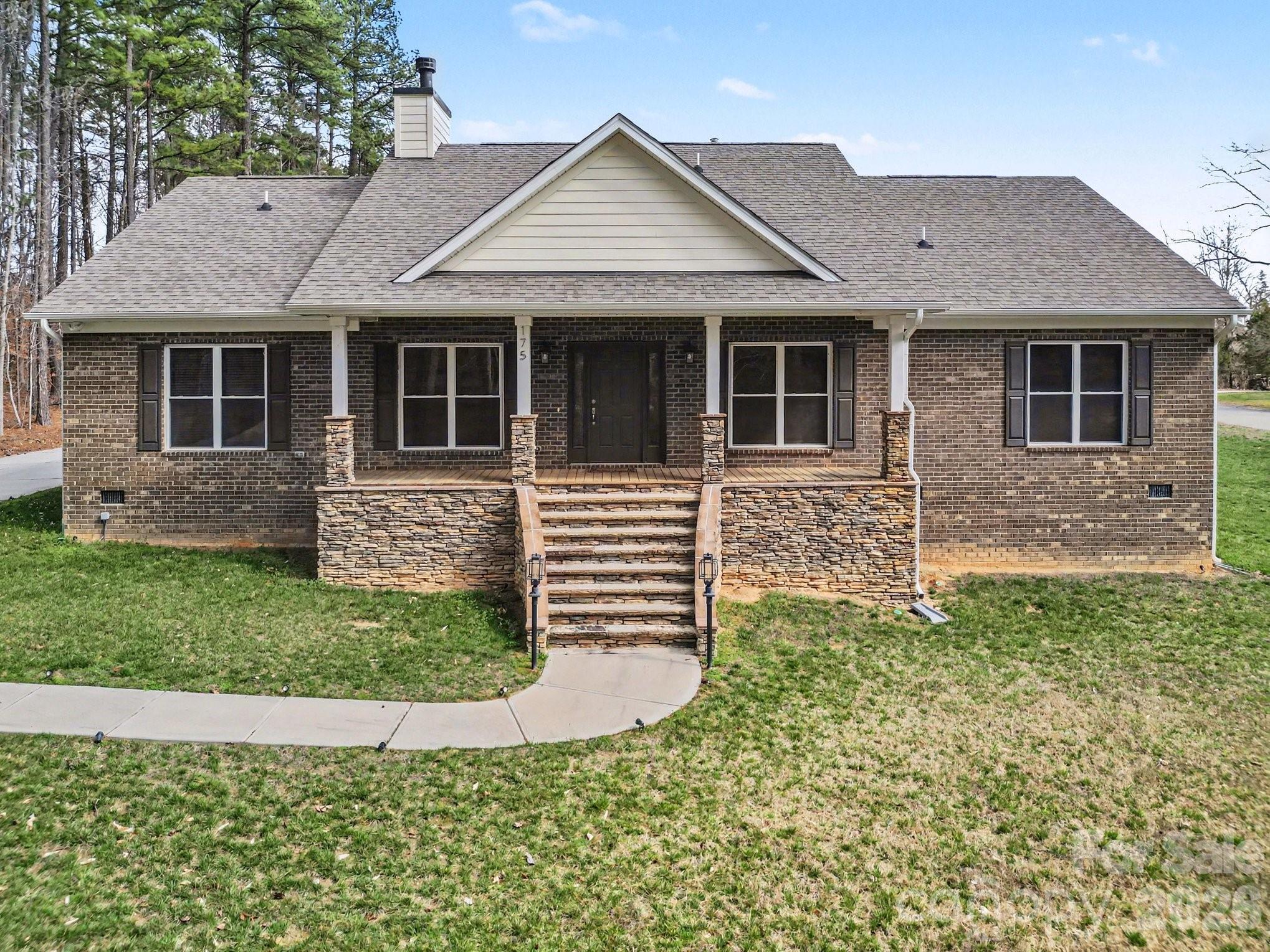 175 Cox Lake Road Stanley, NC 28164 - Photo 1 of 45 a front view of a house with garden