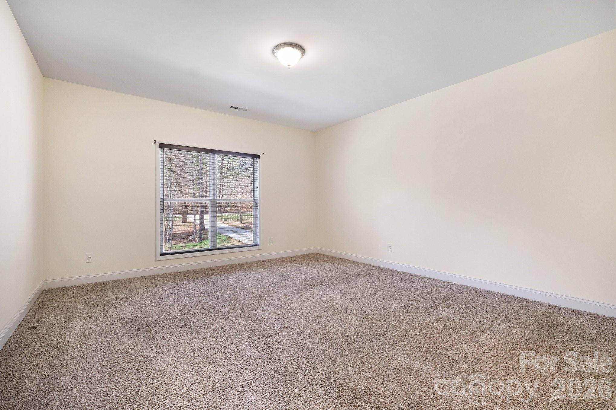 175 Cox Lake Road Stanley, NC 28164 - Photo 11 of 45 an empty room with windows