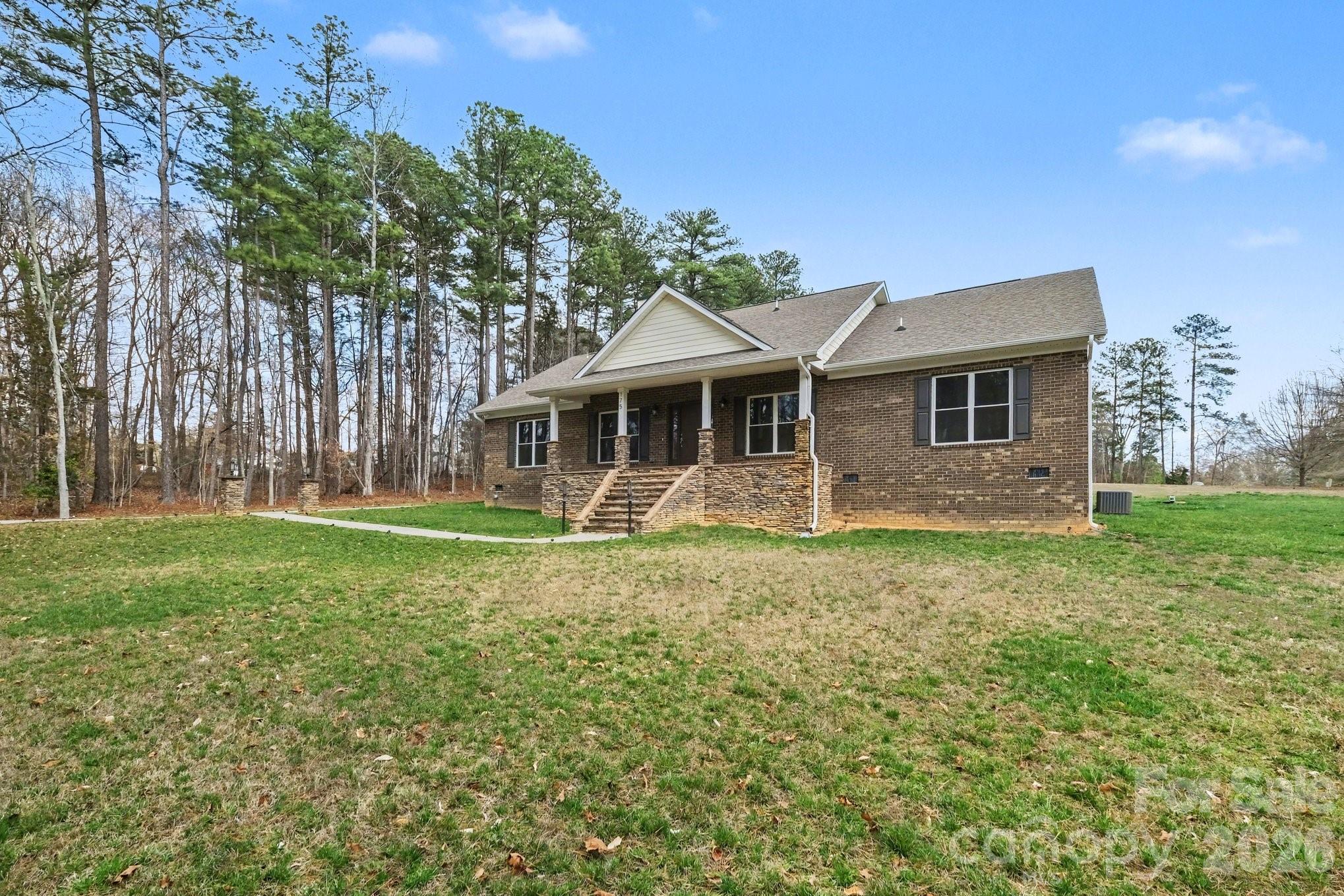 175 Cox Lake Road Stanley, NC 28164 - Photo 2 of 45 a front view of a house with garden