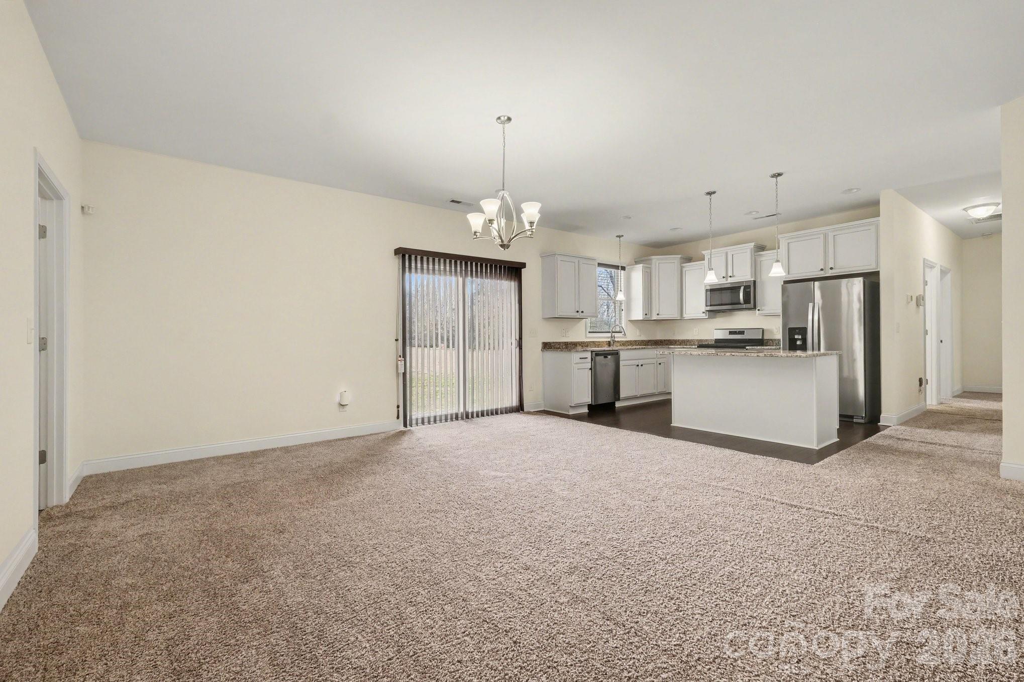 175 Cox Lake Road Stanley, NC 28164 - Photo 25 of 45 a view of a kitchen with refrigerator and a stove