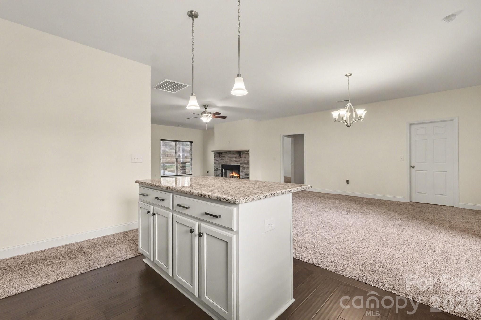 175 Cox Lake Road Stanley, NC 28164 - Photo 28 of 45 a kitchen that has a lot of cabinets in it