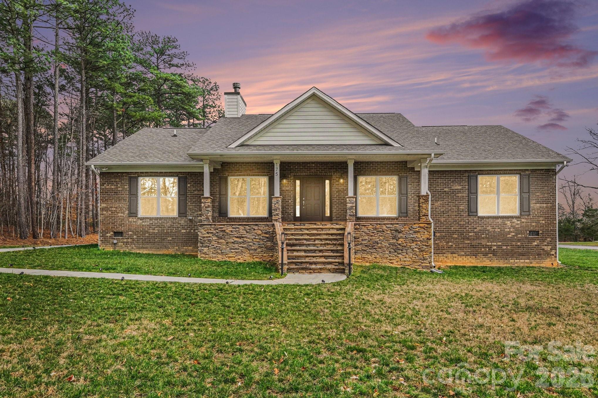 175 Cox Lake Road Stanley, NC 28164 - Photo 3 of 45 a front view of a house with a yard