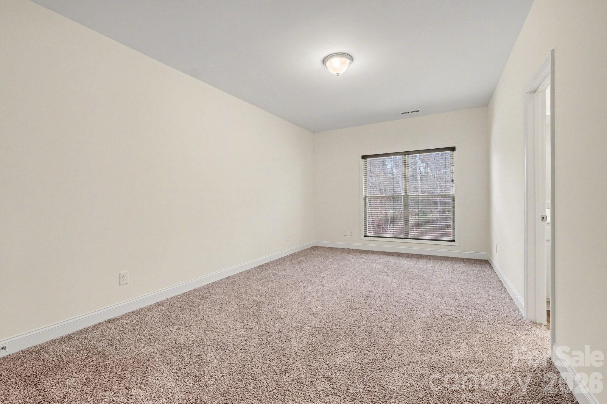 175 Cox Lake Road Stanley, NC 28164 - Photo 33 of 45 an empty room with windows