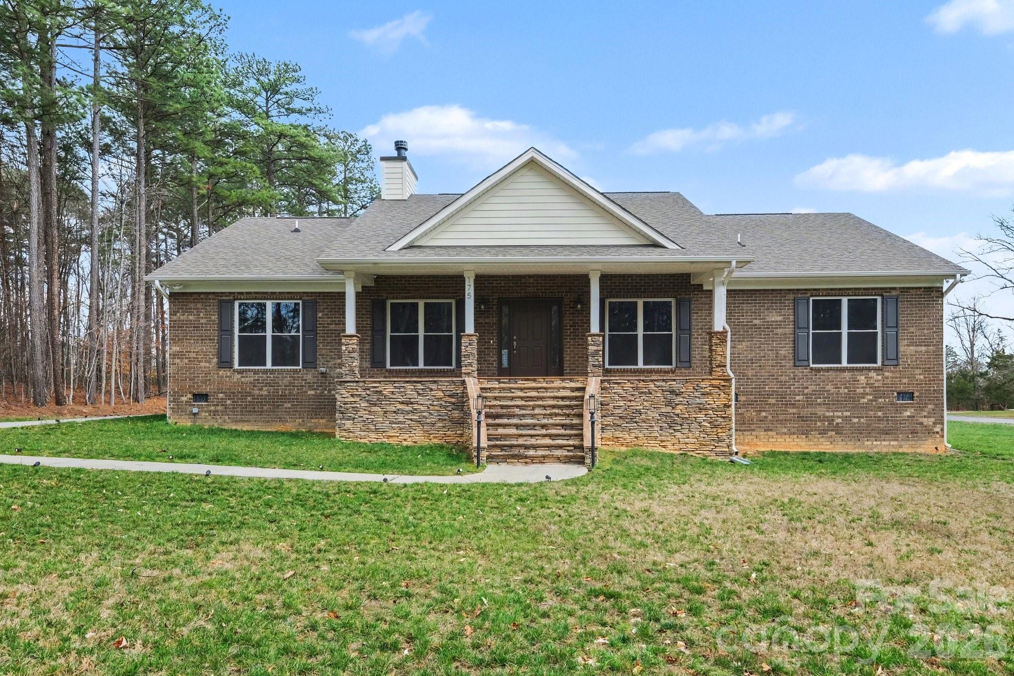175 Cox Lake Road Stanley, NC 28164 - Photo 38 of 45 a front view of a house with a yard
