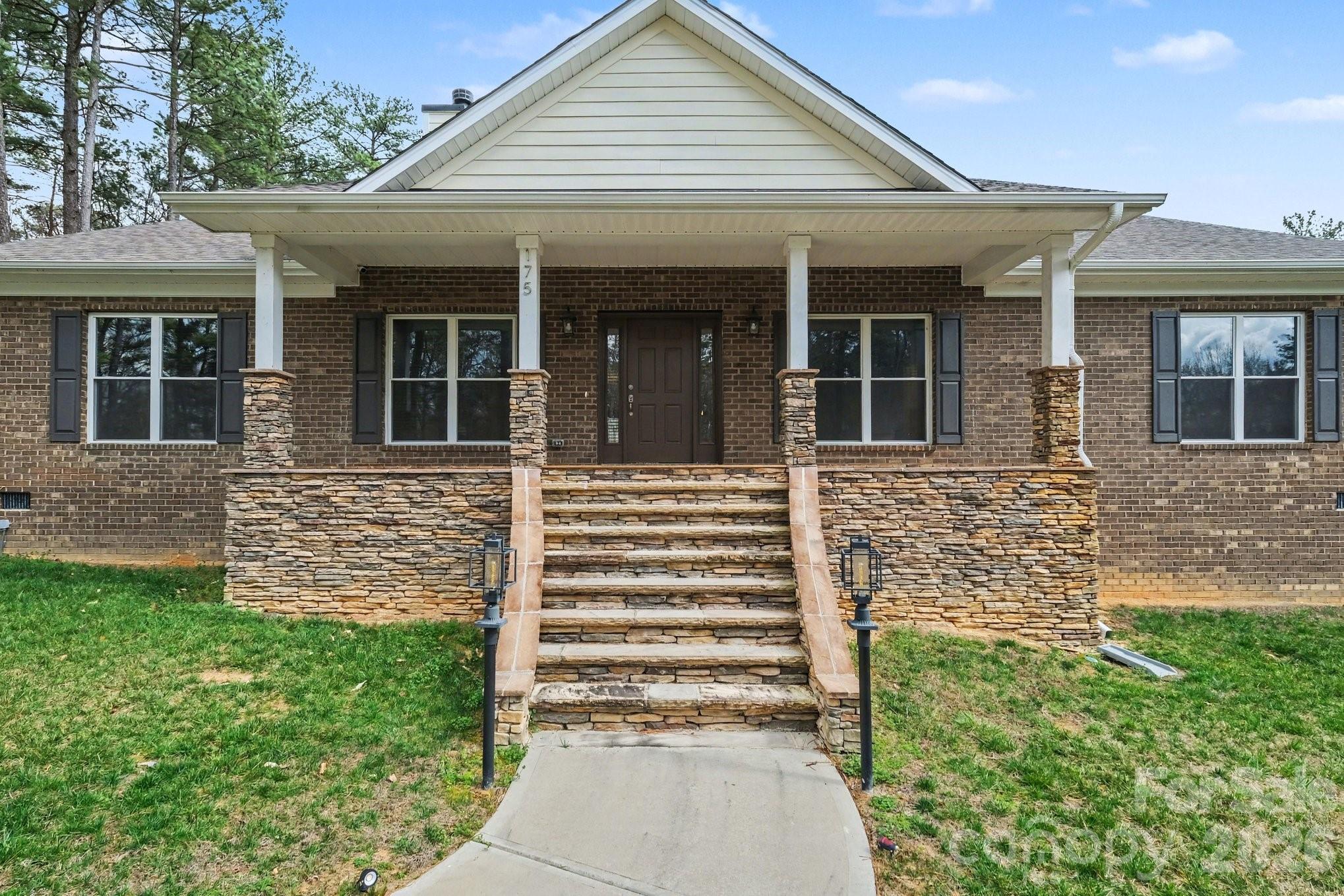 175 Cox Lake Road Stanley, NC 28164 - Photo 39 of 45 front view of a house with a yard