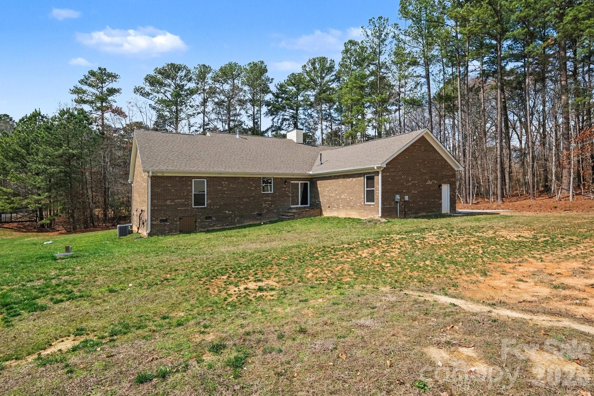 175 Cox Lake Road Stanley, NC 28164 - Photo 42 of 45 a front view of a house with a yard and garage