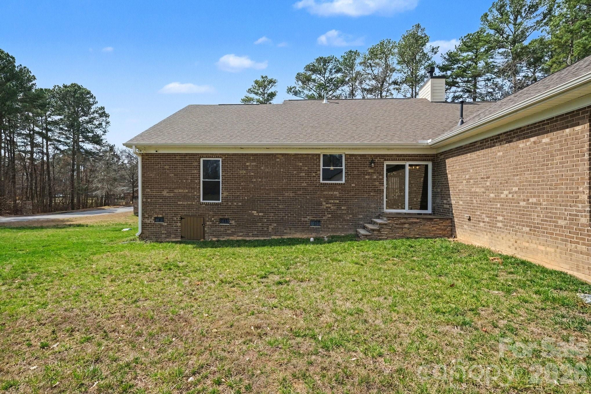 175 Cox Lake Road Stanley, NC 28164 - Photo 43 of 45 a backyard of a house with lots of green space