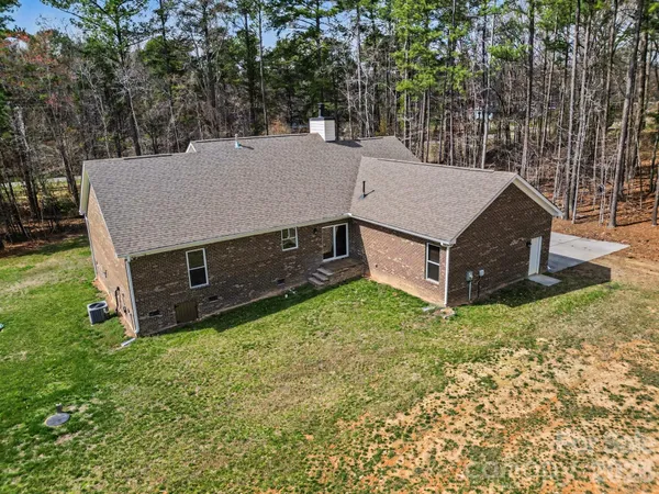 a aerial view of a house with a yard