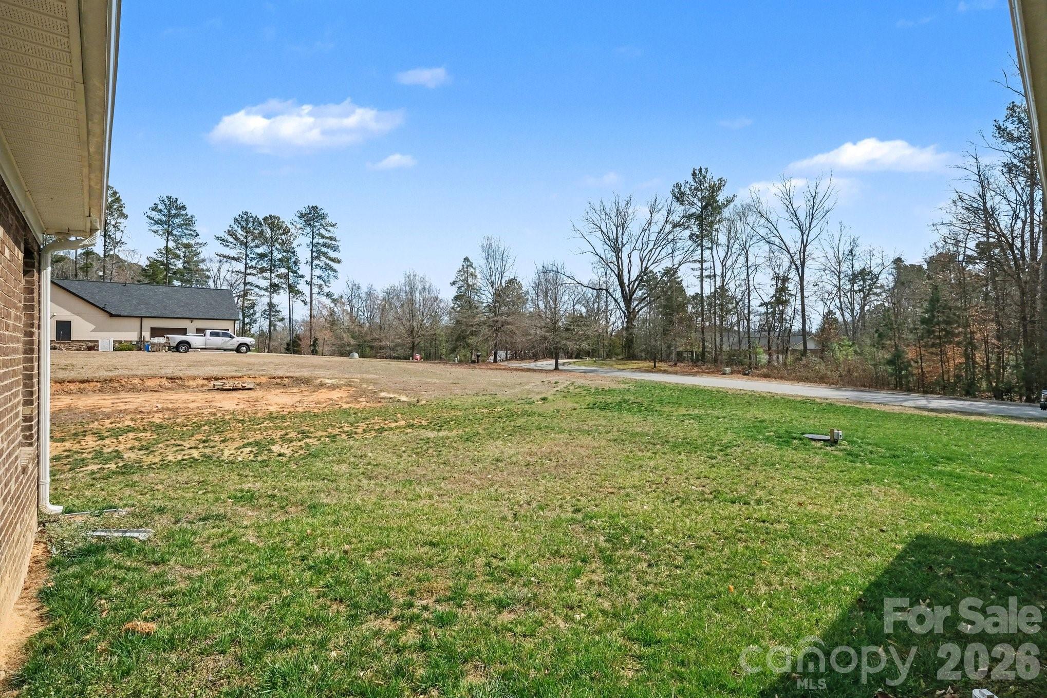 175 Cox Lake Road Stanley, NC 28164 - Photo 9 of 45 a view of a field with large trees
