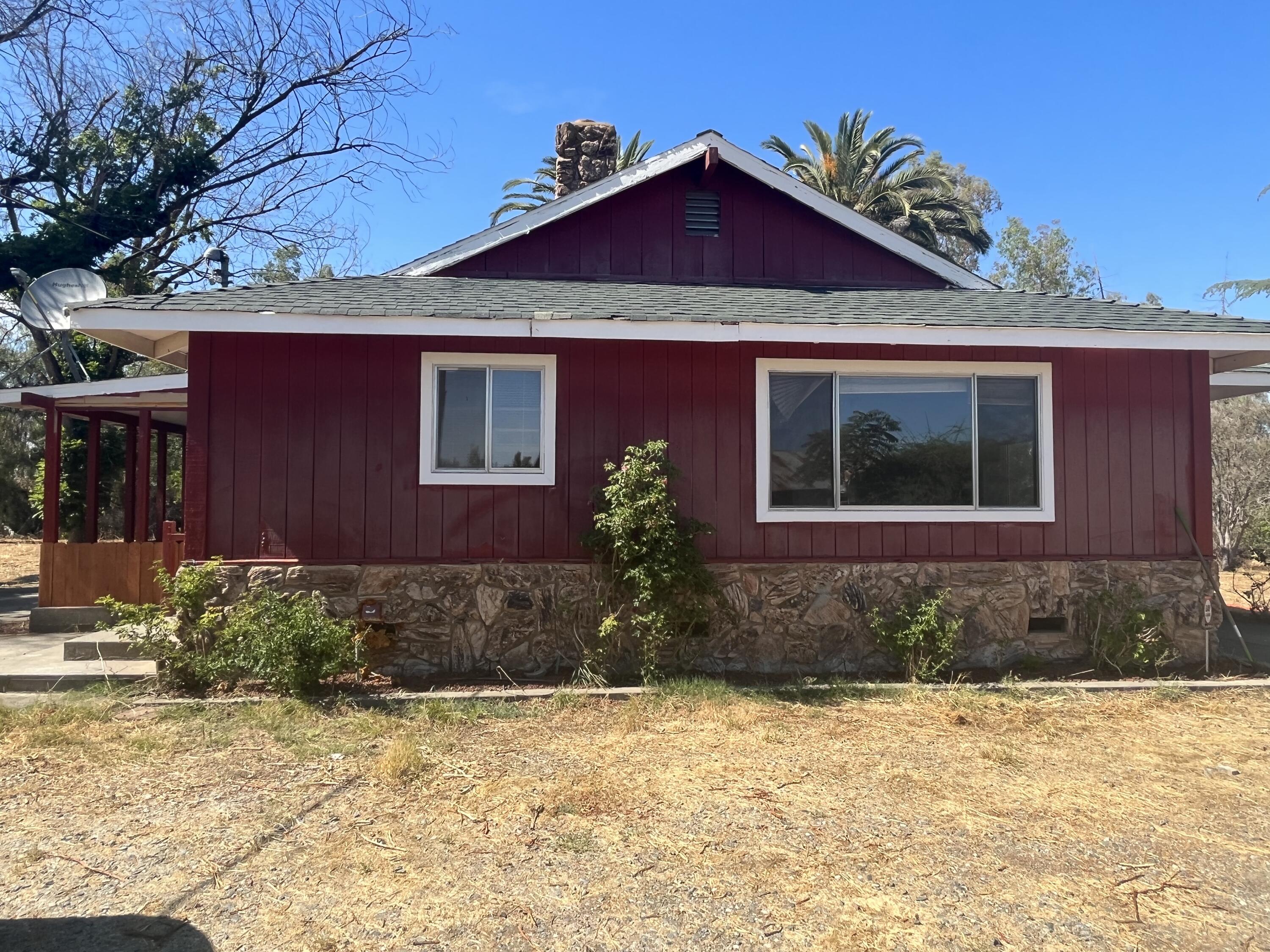 2713 Woodson Avenue Corning, CA 96021 - Photo 1 of 38 a front view of a house with garden
